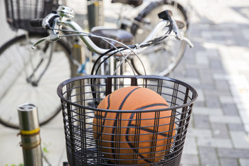 Basketball in a bicycle basket