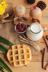 Fototapeta na wymiar Sweet waffles and fresh milk with jam.