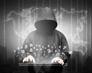 Computer hacker silhouette of hooded man