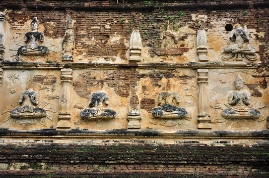 Buddha image stucco on wall of Wat Chet Yod, Chiangmai, Thailand