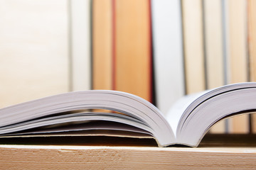 Open book, hardback books on wooden table. Back to school. Copy space