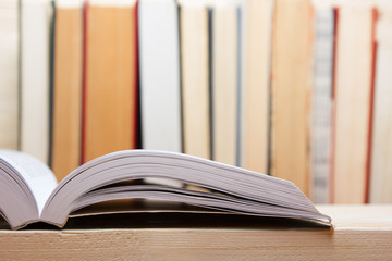 Open book on wooden table. Back to school. Copy space