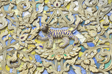 Tiger image stucco on wall of Watsuandok, Chiangmai, Thailand