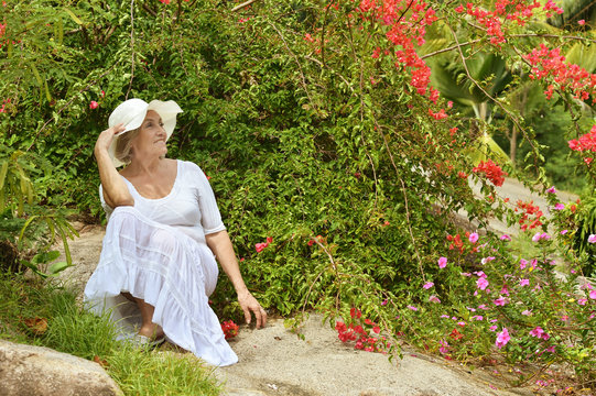 Older Woman  With Red  Flowers