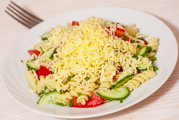 pasta salad with cheese, tomato and cucumber