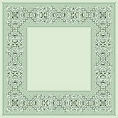 Filigree floral frame on light green.