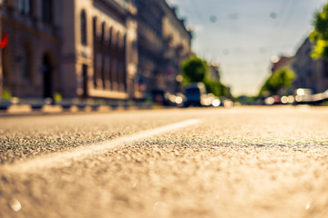 City on a sunny day, a quiet street with trees and cars