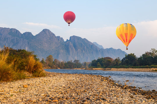 Hot air ballon over river in Vangvieng