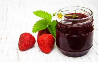 Strawberry jam and fresh strawberries