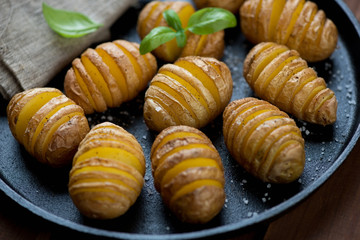 Potato cut into slices almost right through and then roasted