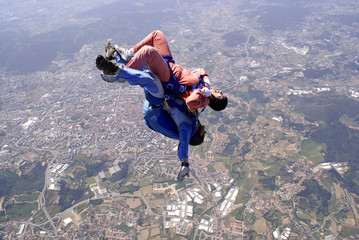 Skydiving tandem jump back to earth.