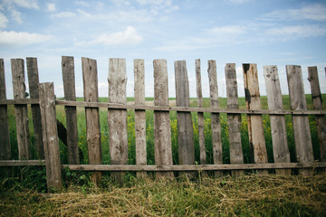 Fototapeta premium wooden fence at the grass