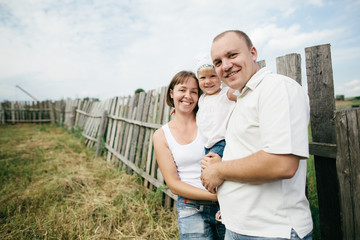 happy mother and father with child