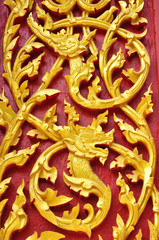 Naga and dragon wood carving at Wat Se Nas, Phitsanulok, Thailand
