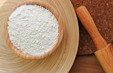 white wheat flour baking preparation wooden kitchen utensils organic natural rolling pin plate bowl 