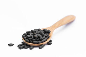 Black Peas in a wooden spoon On white Background