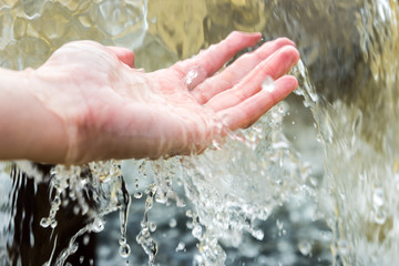 Woman's palm in water