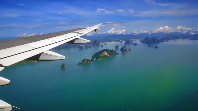 View from the airplane window to sparse islands in timelapse. FullHD 1080p.