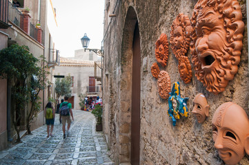 View of some ceramic souvenirs outside a tourist shop in the medieval village Erice, West Sicily,...
