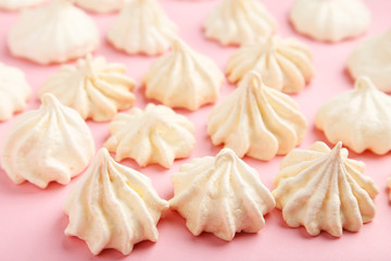 French meringue cookies on pink background