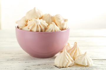 French meringue cookies on white wooden background