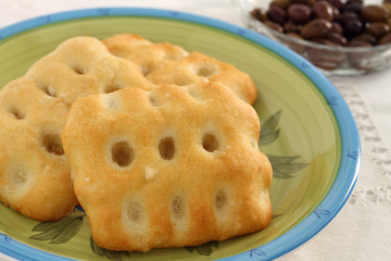 Focaccia with black olives background
