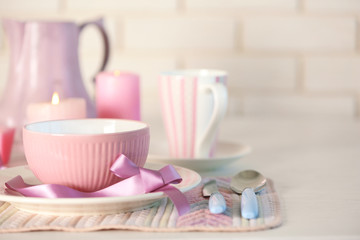 Beautiful holiday table setting in pink color