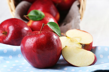 Ripe red apples on table close up