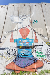 Fototapeta na wymiar Bethlehem - Detail of graffiti on the Separation barrier.