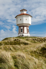 Fototapeta na wymiar Water tower in the dunes of the East Frisian island Langeoog, Lower Saxony, Germany