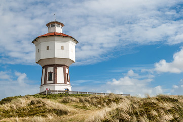 Fototapeta na wymiar Water tower in the dunes of the East Frisian island Langeoog, Lower Saxony, Germany