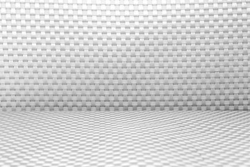 Black and white plastic seat of chair, textured background.
