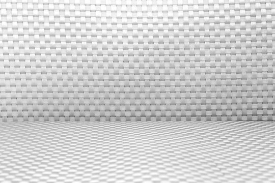 Black and white plastic seat of chair, textured background.