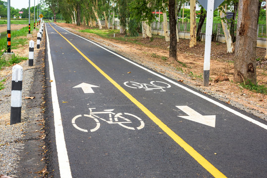 Bicycle road sign on asphalt.