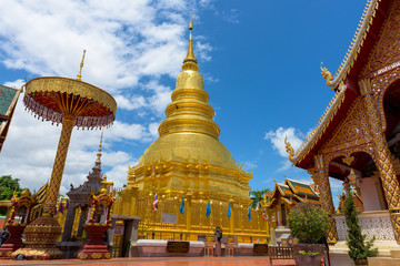 Fototapeta premium Wat Phra That Hariphunchai with blue sky in Lamphun Province, Th