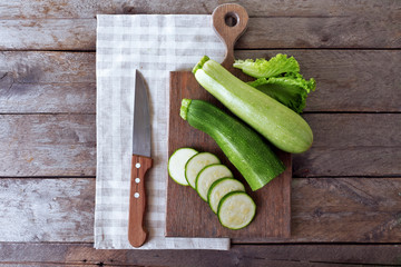Fresh zucchini with squash on cutting board