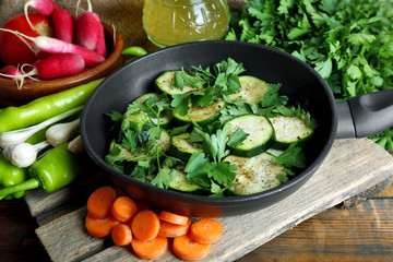 Sliced zucchini in pan on table, closeup