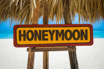 Honeymoon sign with beach background