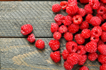 Sweet raspberries on wooden  background