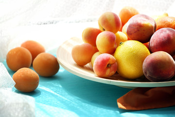 Heap of fresh fruits on windowsill