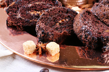 Delicious chocolate roll on metal plate, closeup