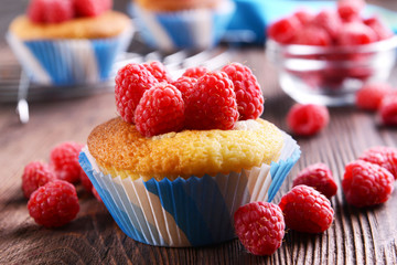 Delicious cupcake with berries on table close up