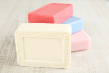 Bars of natural soap on light background
