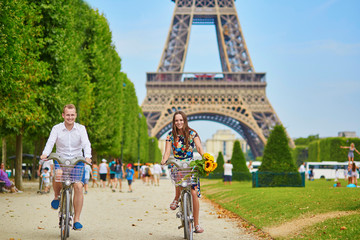 Young couple using bicycles in Paris, France © Ekaterina Pokrovsky