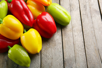 Colorful peppers on rustic wooden background
