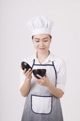 Portrait of a Asian woman with chef uniform holding a rice bowl