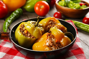 Stuffed peppers with vegetables on table close up