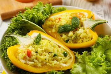 Stuffed peppers with vegetables on table close up