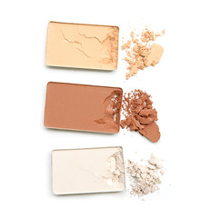 Three shade colors of make-up powder on white background