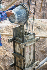 construction worker controlling pile form filling with continuou